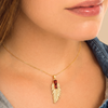 Gold Feather Pendant Necklace with Red Zirconia Stones